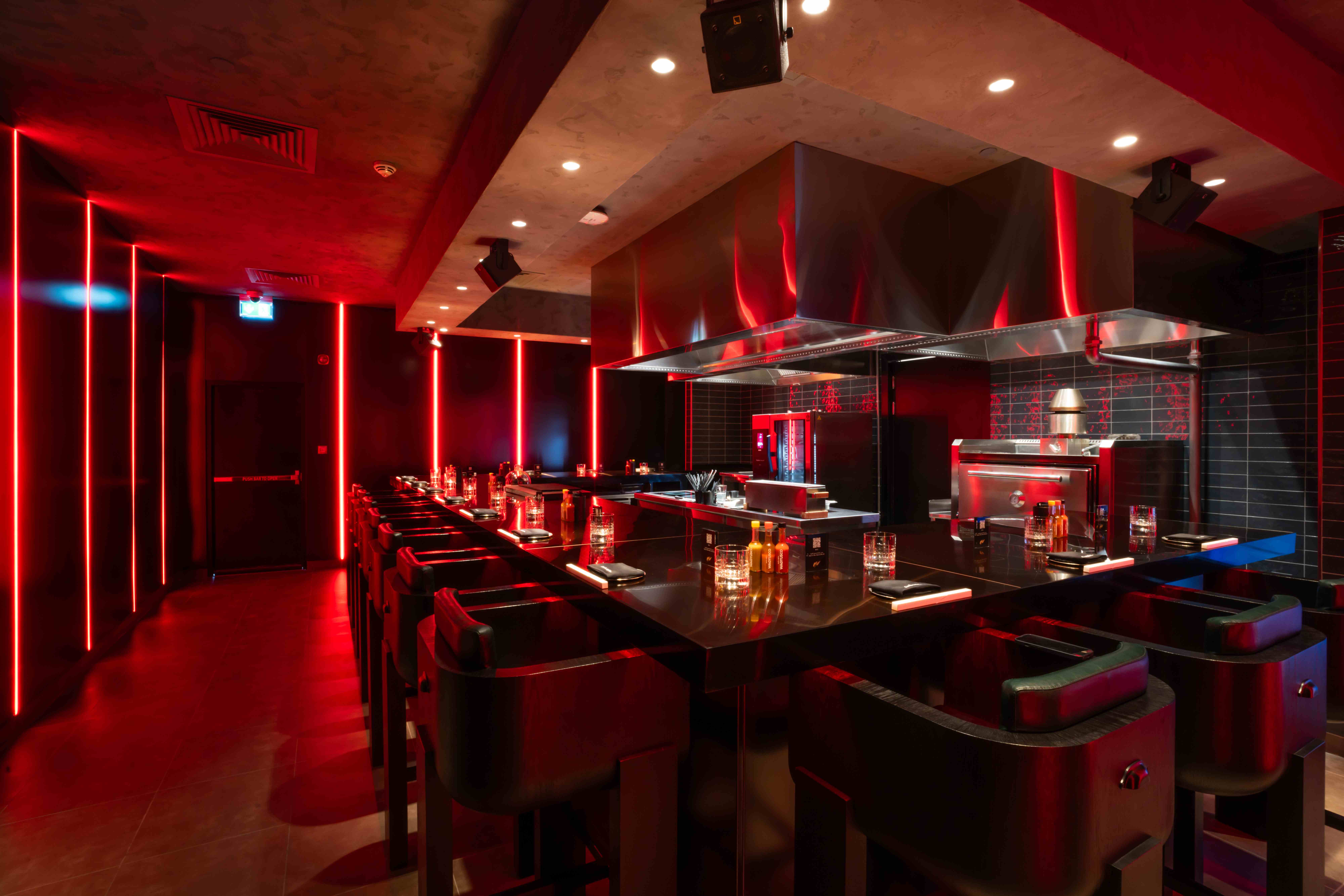 Contemporary restaurant with dramatic red ambient lighting